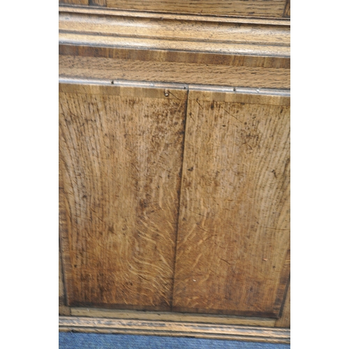 213 - A GEORGIAN OAK EIGHT DAY LONGCASE CLOCK, the hood with a broken arch pediment, three brass finials, ... 