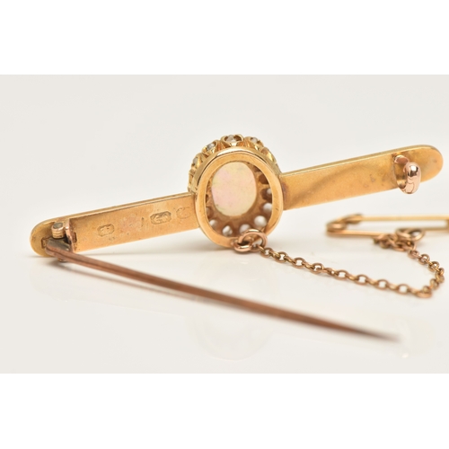 419 - A BOXED OPAL AND DIAMOND BAR BROOCH, designed as an oval cluster set with a central oval cut white o... 