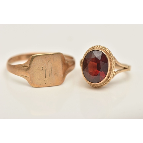 431 - TWO 9CT GOLD RINGS, the first set with an oval cut garnet, hallmarked 9ct Birmingham, ring size D 1/... 