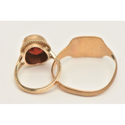 431 - TWO 9CT GOLD RINGS, the first set with an oval cut garnet, hallmarked 9ct Birmingham, ring size D 1/... 