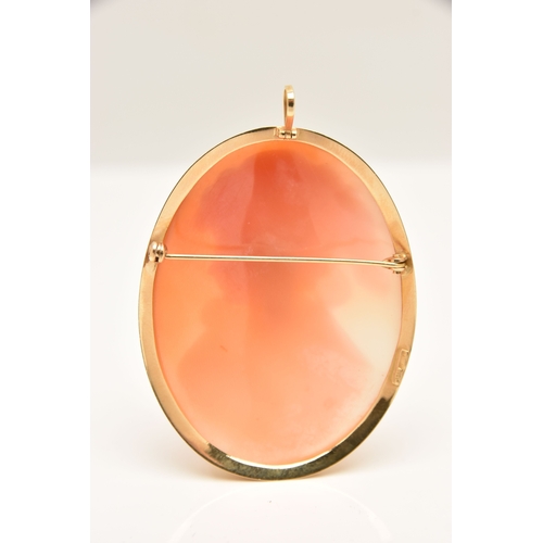 438 - A LARGE YELLOW METAL CAMEO BROOCH, carved shell cameo depicting a lady in profile, collet set with a... 