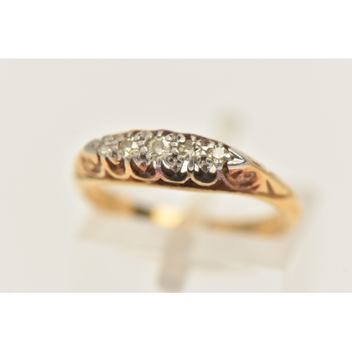 452 - A YELLOW METAL DIAMOND BOAT RING, one small round brilliant cut diamond and four single cut diamonds... 