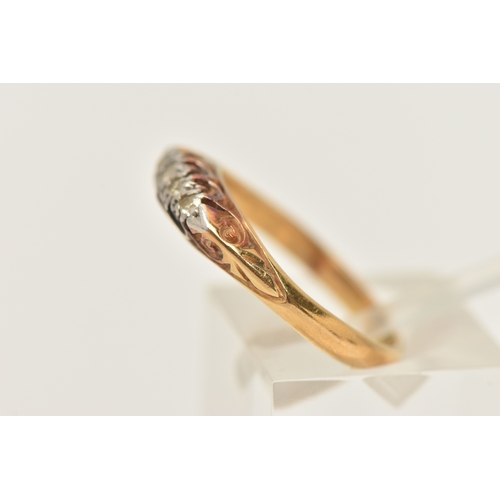 452 - A YELLOW METAL DIAMOND BOAT RING, one small round brilliant cut diamond and four single cut diamonds... 