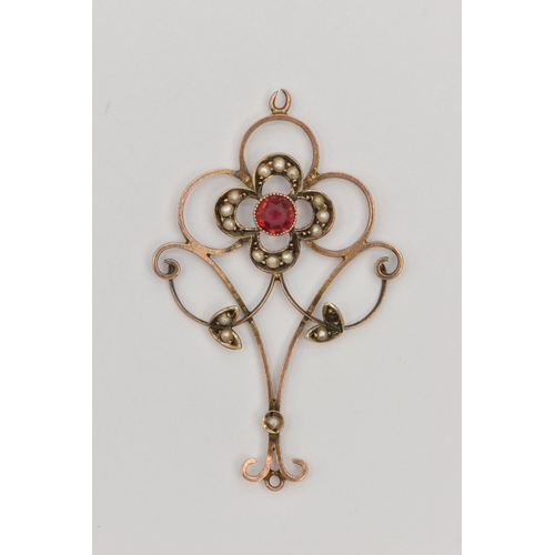460 - A YELLOW METAL GEM SET LAVALIER PENDANT, open work design set with a red paste and split pearl accen... 