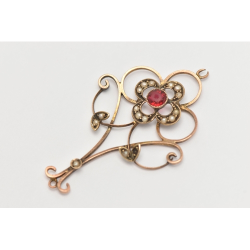 460 - A YELLOW METAL GEM SET LAVALIER PENDANT, open work design set with a red paste and split pearl accen... 
