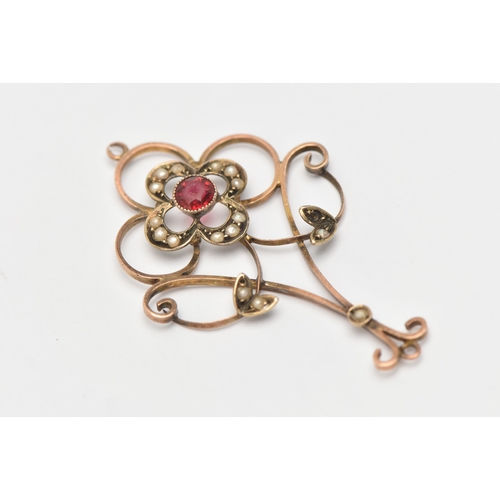 460 - A YELLOW METAL GEM SET LAVALIER PENDANT, open work design set with a red paste and split pearl accen... 