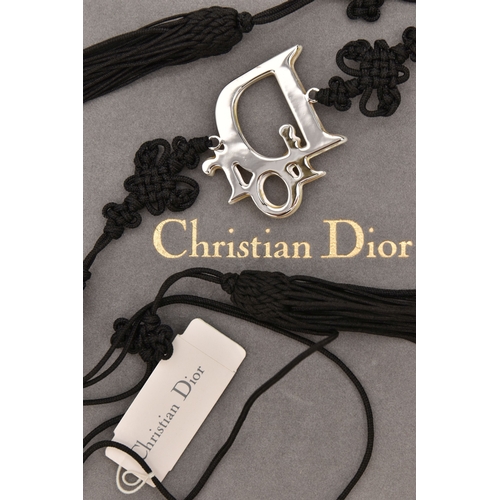 476 - A 'CHRISTIAN DIOR' BELT, a black cordette belt with oriental detail and tassel terminations, fitted ... 