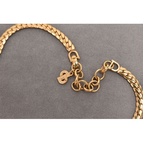 478 - A 'CHRISTIAN DIOR' NECKLACE, a yellow metal flat link chain set with circular cut and baguette cut c... 