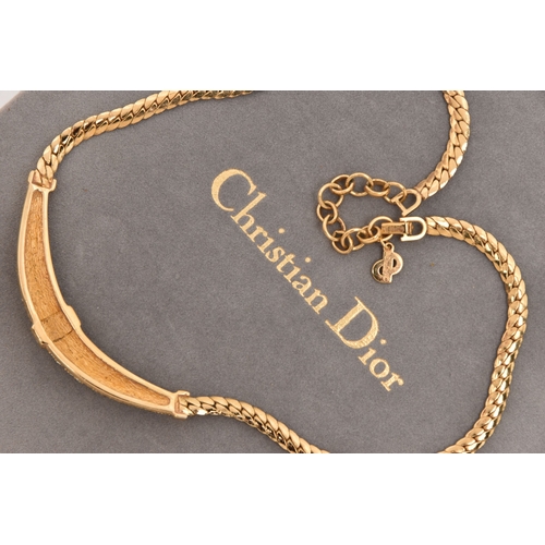 478 - A 'CHRISTIAN DIOR' NECKLACE, a yellow metal flat link chain set with circular cut and baguette cut c... 