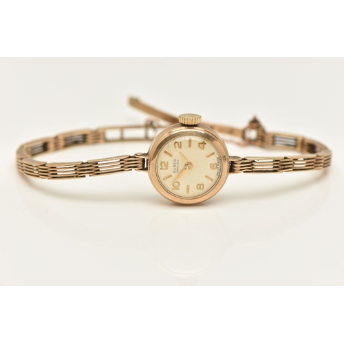 494 - A LADIES 9CT GOLD 'BUREN' WRISTWATCH, manual wind, round silvered dial signed 'Buren Grand Prix', al... 