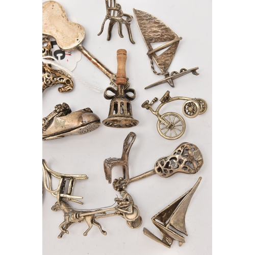 519 - AN ASSORTMENT OF WHITE METAL MINIATURE TRINKETS, to include rocking horses, umbrella, guitar, chairs... 