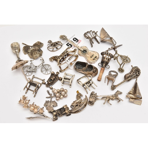 519 - AN ASSORTMENT OF WHITE METAL MINIATURE TRINKETS, to include rocking horses, umbrella, guitar, chairs... 