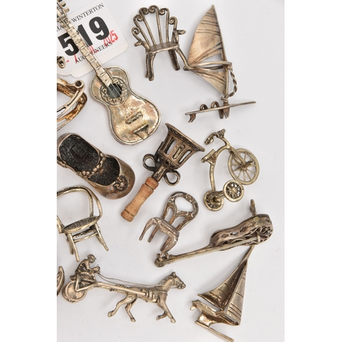 519 - AN ASSORTMENT OF WHITE METAL MINIATURE TRINKETS, to include rocking horses, umbrella, guitar, chairs... 