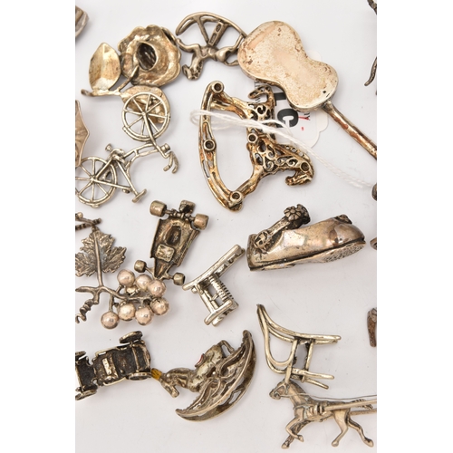 519 - AN ASSORTMENT OF WHITE METAL MINIATURE TRINKETS, to include rocking horses, umbrella, guitar, chairs... 