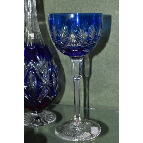 810 - A GROUP OF BLUE CUT TO CLEAR GLASSWARE, possibly Bohemian, to include a decanter of footed form, hei... 