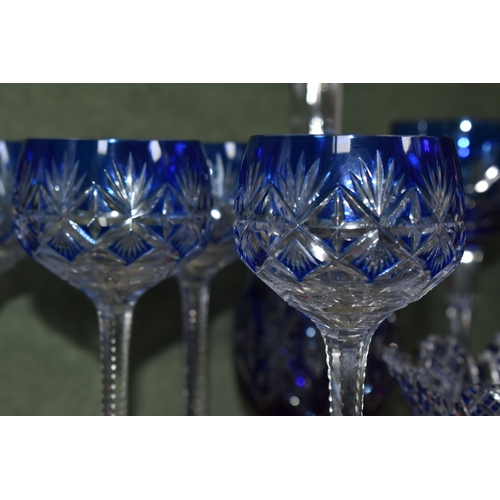 810 - A GROUP OF BLUE CUT TO CLEAR GLASSWARE, possibly Bohemian, to include a decanter of footed form, hei... 