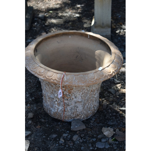 11 - A PAIR OF TERRACOTTA PLANT POTS, with a moulded design to the side, 45cm x height 33cm, condition re...