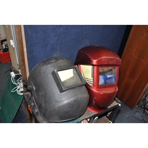 93 - A CLARKE GWC1 WHEELED WELDER STAND with two masks (3)...