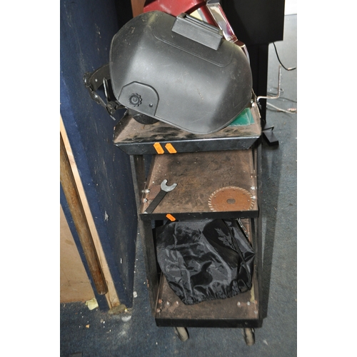 93 - A CLARKE GWC1 WHEELED WELDER STAND with two masks (3)...