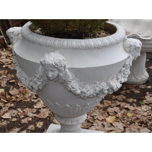 13 - A LARGE PAINTED CONCRETE GARDEN URN with foliate detail, four masks to bowl that's joined by swags, ... 