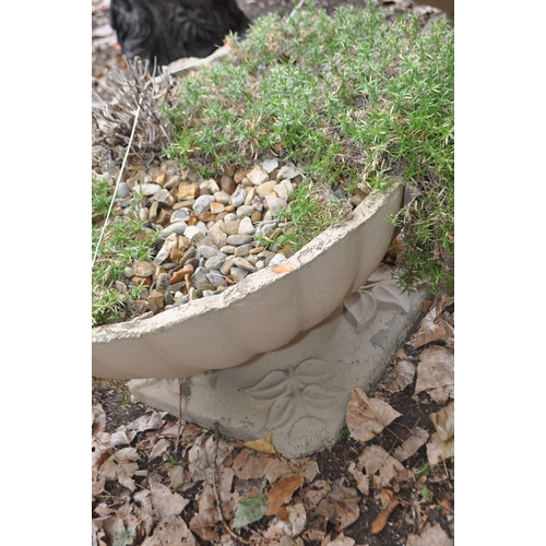 14 - A PAIR OF LARGE CONCRETE GARDEN PLANTERS with a fluted bowl and foliate detail to base, both 78cm in... 