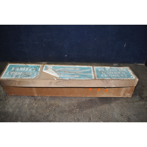 54 - A PLAYSURE GARDEN CROQUET SET with four mallets, six hoops, four balls and two stakes