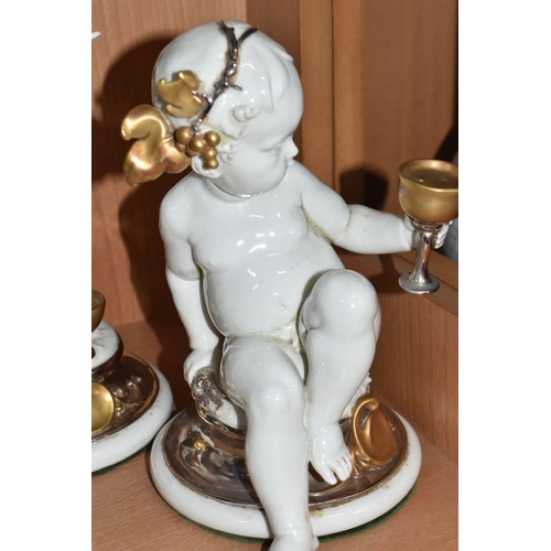 841 - THREE GIUSEPPE CALLÉ CAPODIMONTE FIGURES OF CHERUBS, the porcelain figures wearing gilt and silver l... 