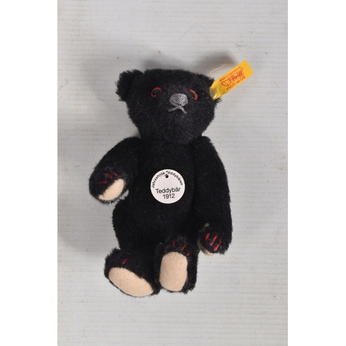 262 - TWO STEIFF CLASSIC TEDDY BEARS, the first a a Titanic Mouring bear replica 1912, no. 003509, yellow ...