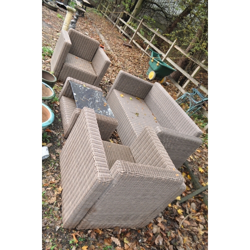 6 - A WOVEN RATTAN GARDEN SET comprising of a two seat sofa (150cm wide), two chairs and coffee table an... 