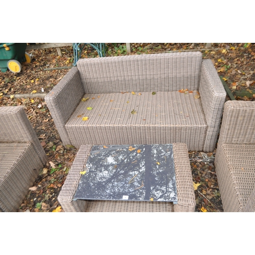 6 - A WOVEN RATTAN GARDEN SET comprising of a two seat sofa (150cm wide), two chairs and coffee table an... 