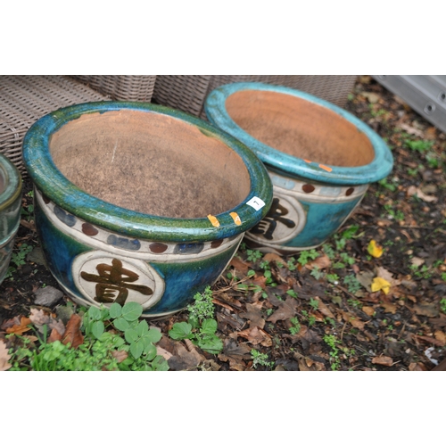 7 - THREE GLAZED GARDEN PLANT POTS including a pair with Chinese characters to bowl, 42cm in diameter (3... 