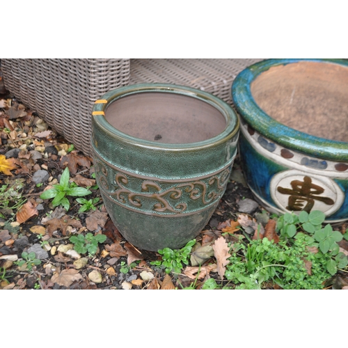 7 - THREE GLAZED GARDEN PLANT POTS including a pair with Chinese characters to bowl, 42cm in diameter (3... 