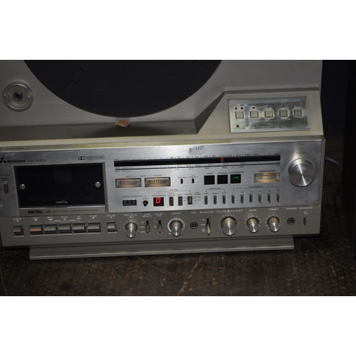 54 - A MITSUBISHI MC8000 MUSIC CENTRE with a linear tracking turntable, FM radio, tape and matching speak... 