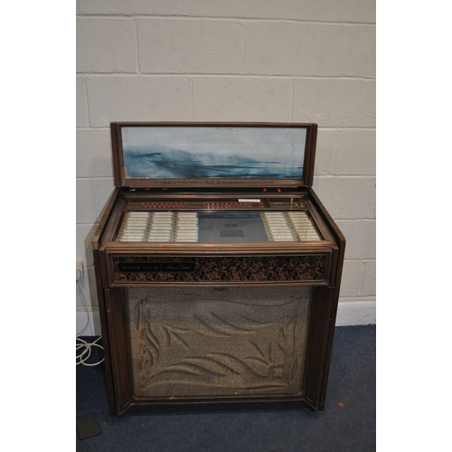 69 - A VINTAGE ROCK-OLA PRINCESS CONSOLE MODEL 461 JUKEBOX with one 45 inside (PAT pass and working). Con... 