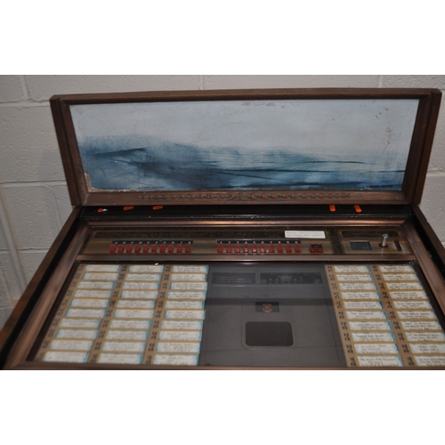 69 - A VINTAGE ROCK-OLA PRINCESS CONSOLE MODEL 461 JUKEBOX with one 45 inside (PAT pass and working). Con... 