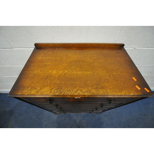 151 - AN EARLY 20TH CENTURY OAK CHEST OF FIVE DRAWERS, raised on scrolled legs, width 85cm x depth 43cm x ... 
