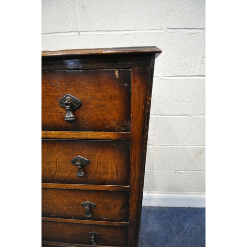 151 - AN EARLY 20TH CENTURY OAK CHEST OF FIVE DRAWERS, raised on scrolled legs, width 85cm x depth 43cm x ... 