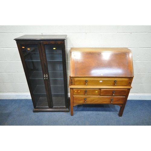 153 - A REPRODUCTION CHEST ON STAND, the fall front door enclosing a fitted interior, atop a base with fou... 