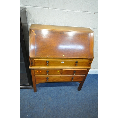 153 - A REPRODUCTION CHEST ON STAND, the fall front door enclosing a fitted interior, atop a base with fou... 
