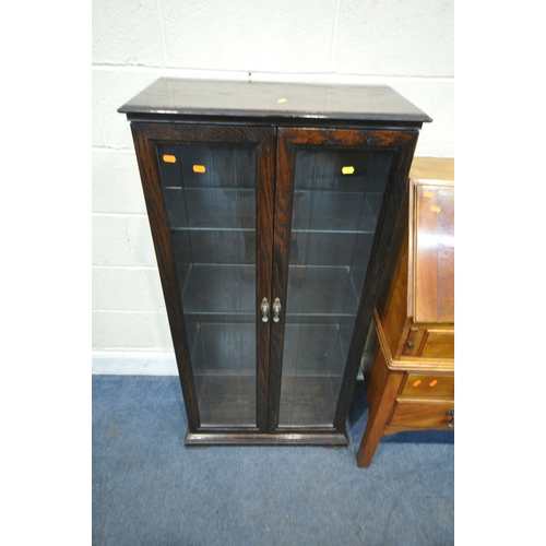153 - A REPRODUCTION CHEST ON STAND, the fall front door enclosing a fitted interior, atop a base with fou... 