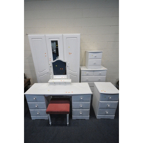 157 - A MODERN WHITE BEDROOM SUITE, comprising a triple door wardrobe, the central door with two rectangul... 
