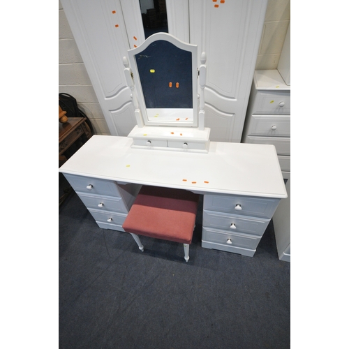 157 - A MODERN WHITE BEDROOM SUITE, comprising a triple door wardrobe, the central door with two rectangul... 