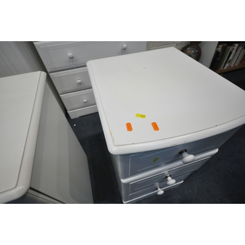 157 - A MODERN WHITE BEDROOM SUITE, comprising a triple door wardrobe, the central door with two rectangul... 