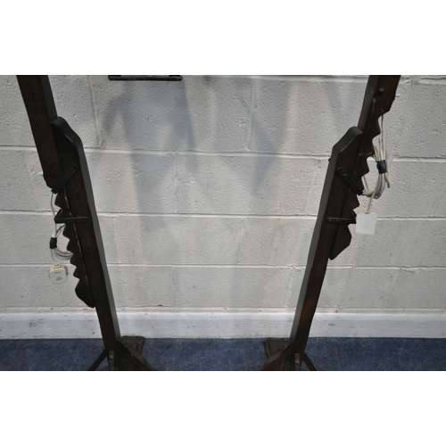 163 - A PAIR OF ARTS AND CRAFTS STYLE OAK STANDARD LAMP, with adjustable height clasp and a four sided gla... 