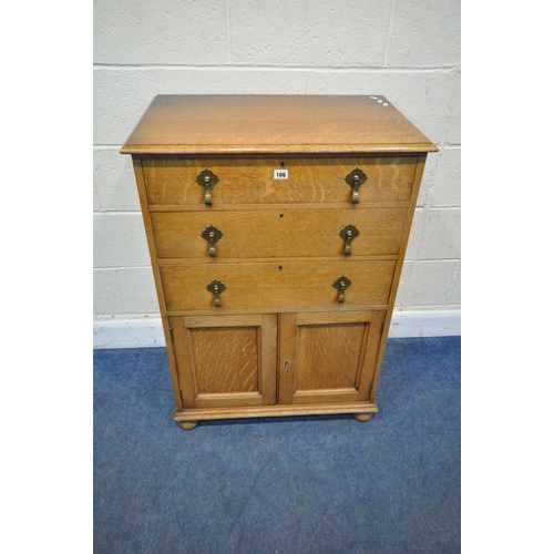 166 - WARING AND GILLOW, AN EARLY 20TH CENTURY OAK CABINET, with three drawers over double cupboard doors,... 