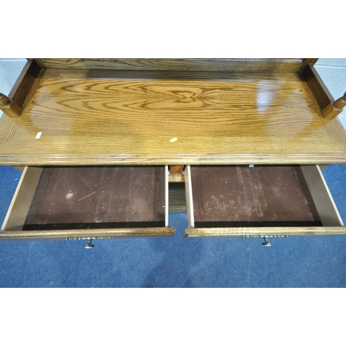 171 - AN OAK MIRROR BACK SIDEBOARD, with turned spindles and supports, two drawers over two lead glazed do... 