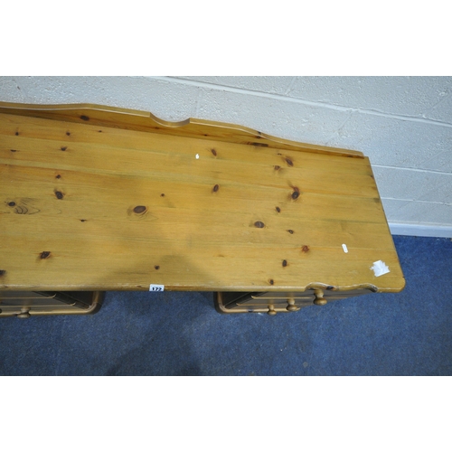 172 - A MODERN PINE DRESSING TABLE, fitted with two banks of three drawers, width 138cm x depth 50cm x hei... 