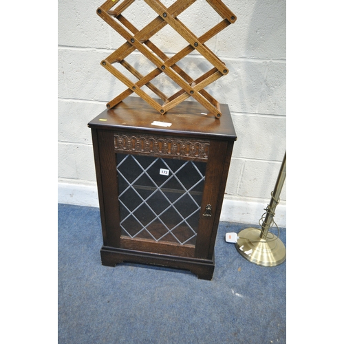 173 - AN OAK MEDIA CABINET, with a single lead glazed door, width 49cm x depth 41cm x height 66cm, along w... 