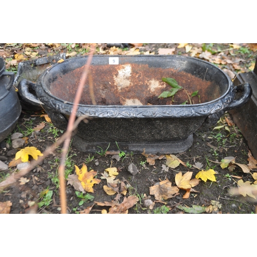 9 - AN EARLY 20th CENTURY CAST IRON OVAL PLANTER in the form of a small bath 69cm long, a modern cauldro... 