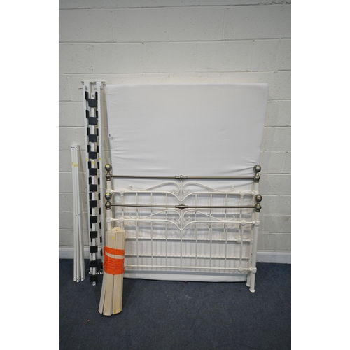 189 - AN UNBRANDED 4FT6 MATTRESS, along  with a tubular metal bedstead, condition report: general signs of... 